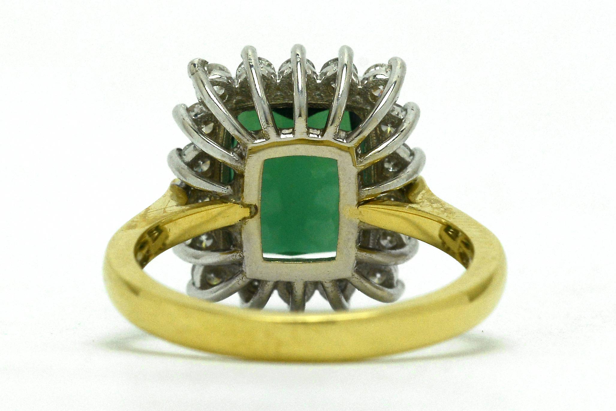 A large, 3 carat green tourmaline in a white gold basket ring setting.