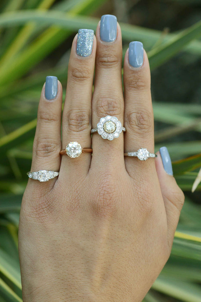 A variety of antique diamond engagement rings in different metal options.