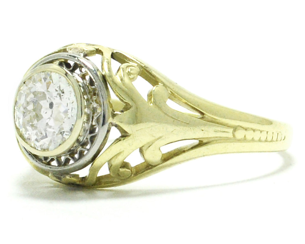 A stunning antique, 14k gold engagement ring with a unique illusion setting.