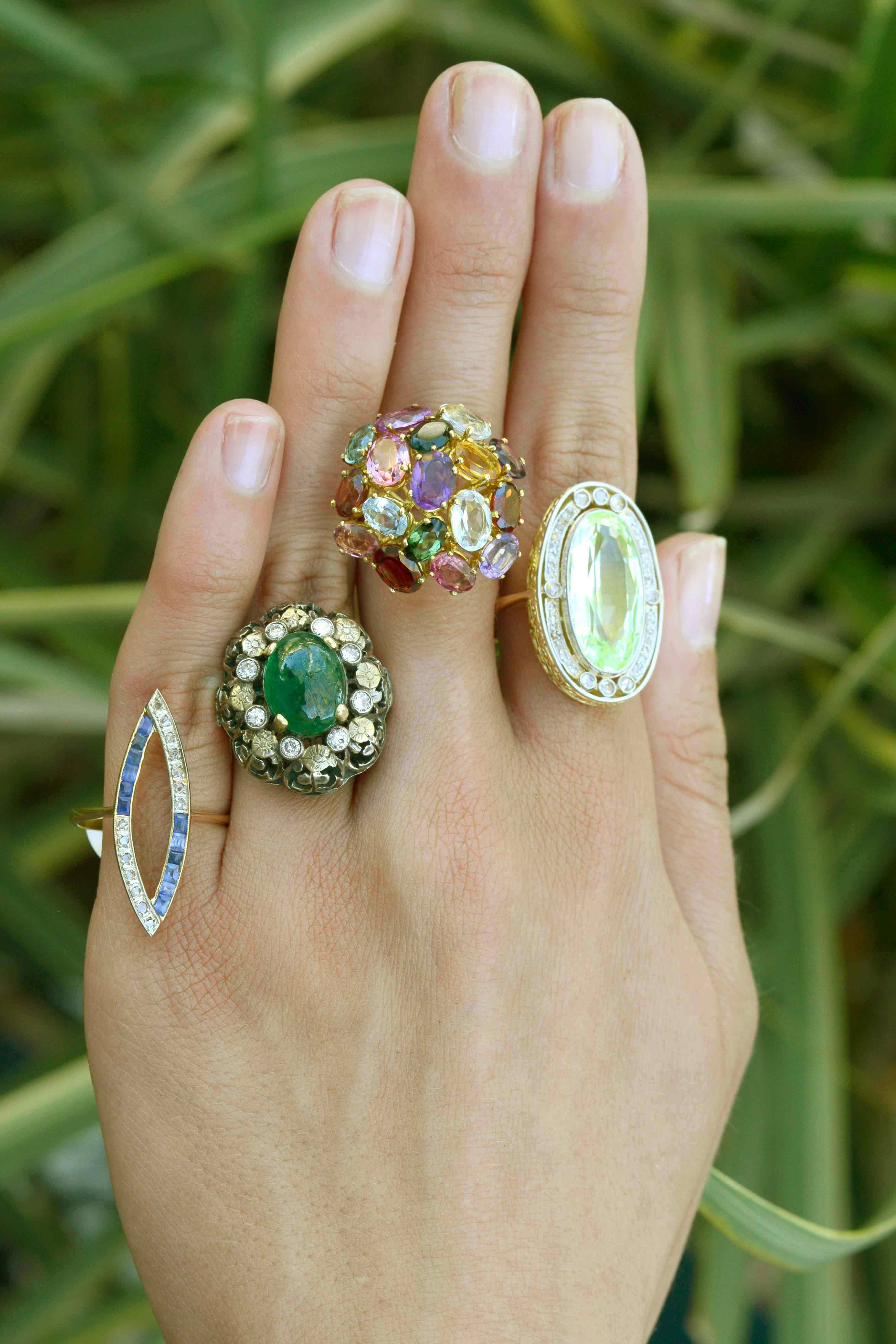 A collection of dome gemstone and diamond cocktail rings.