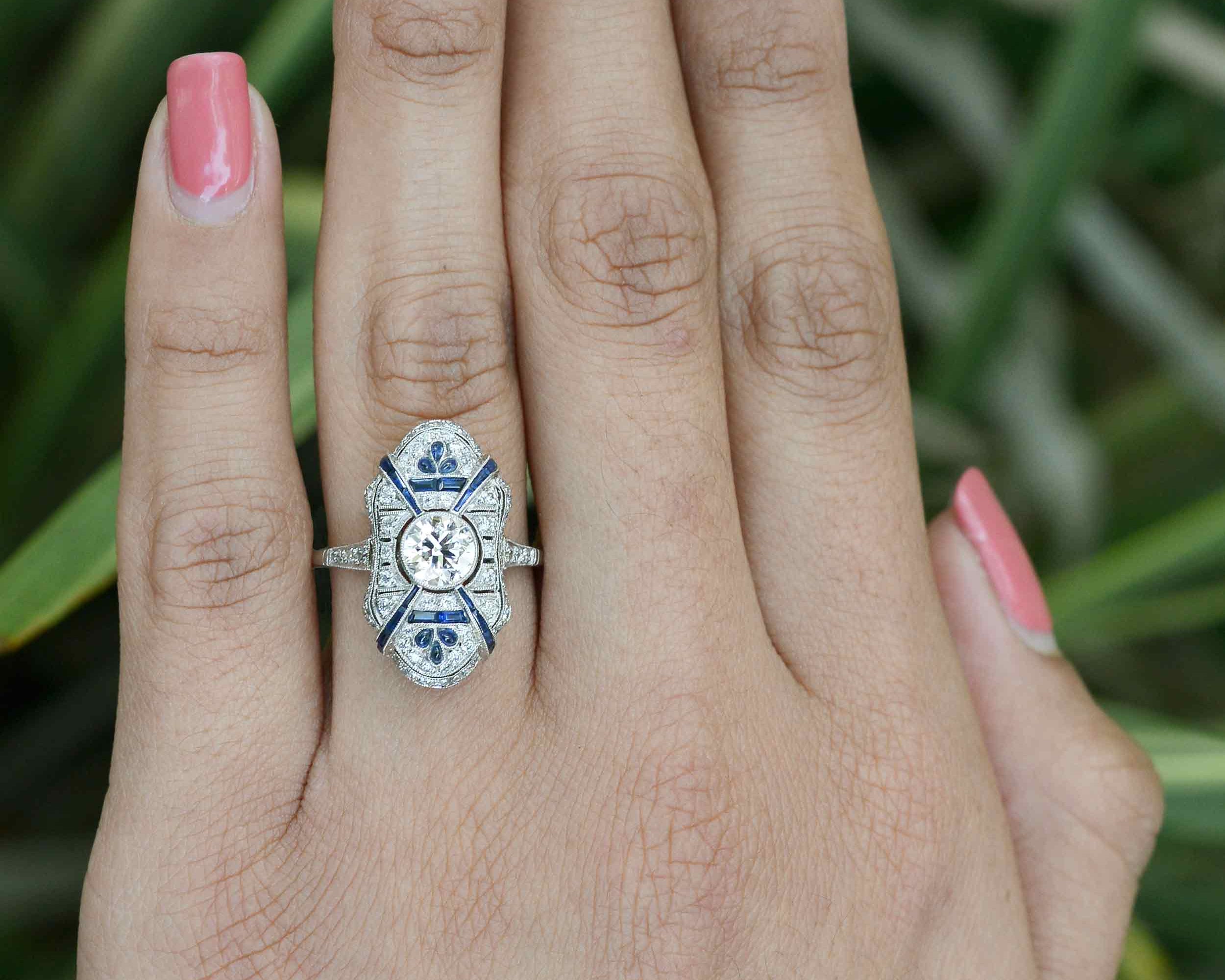 A shield design, platinum antique Art Deco engagement ring.