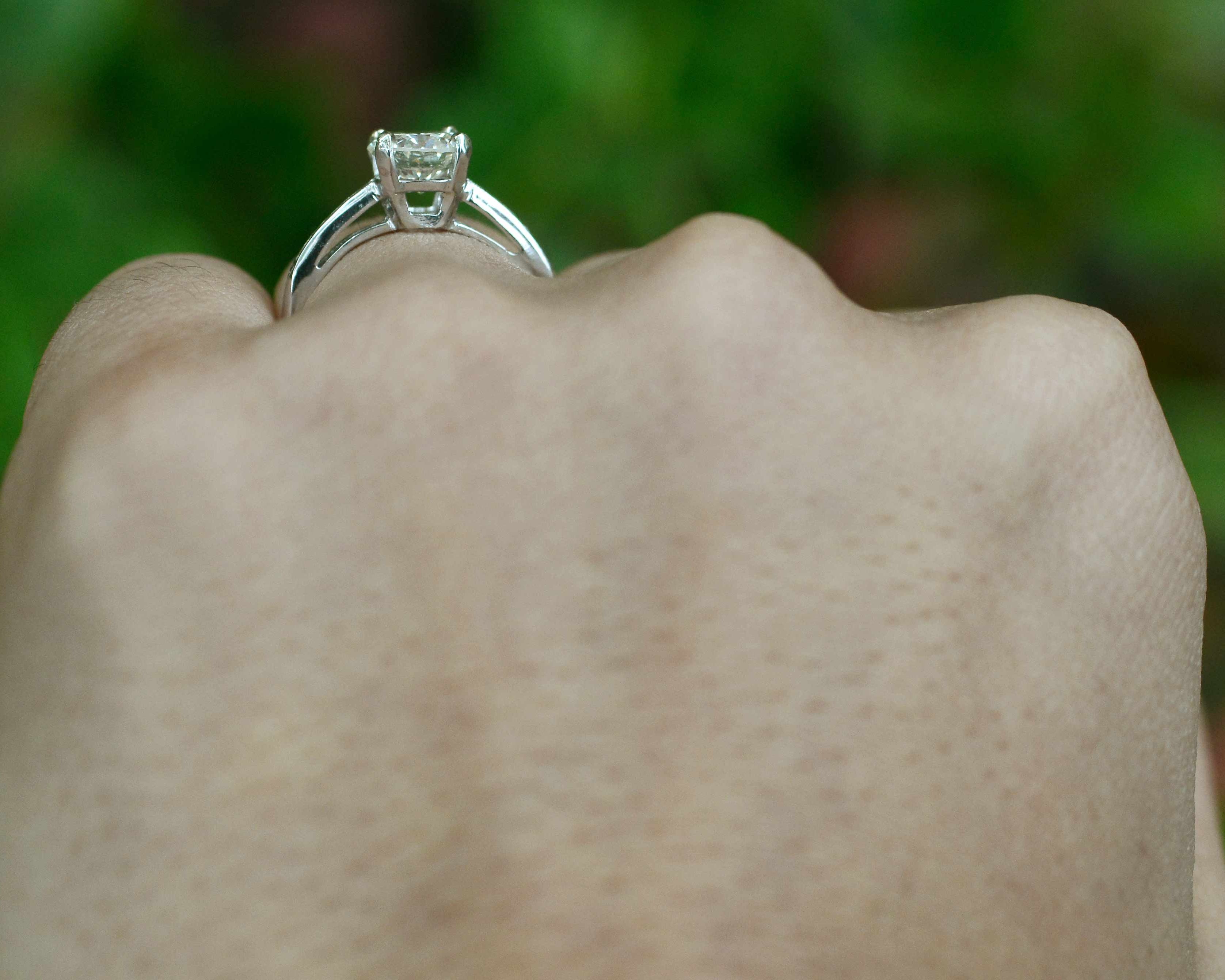 A secure four prong diamond setting solitaire ring.