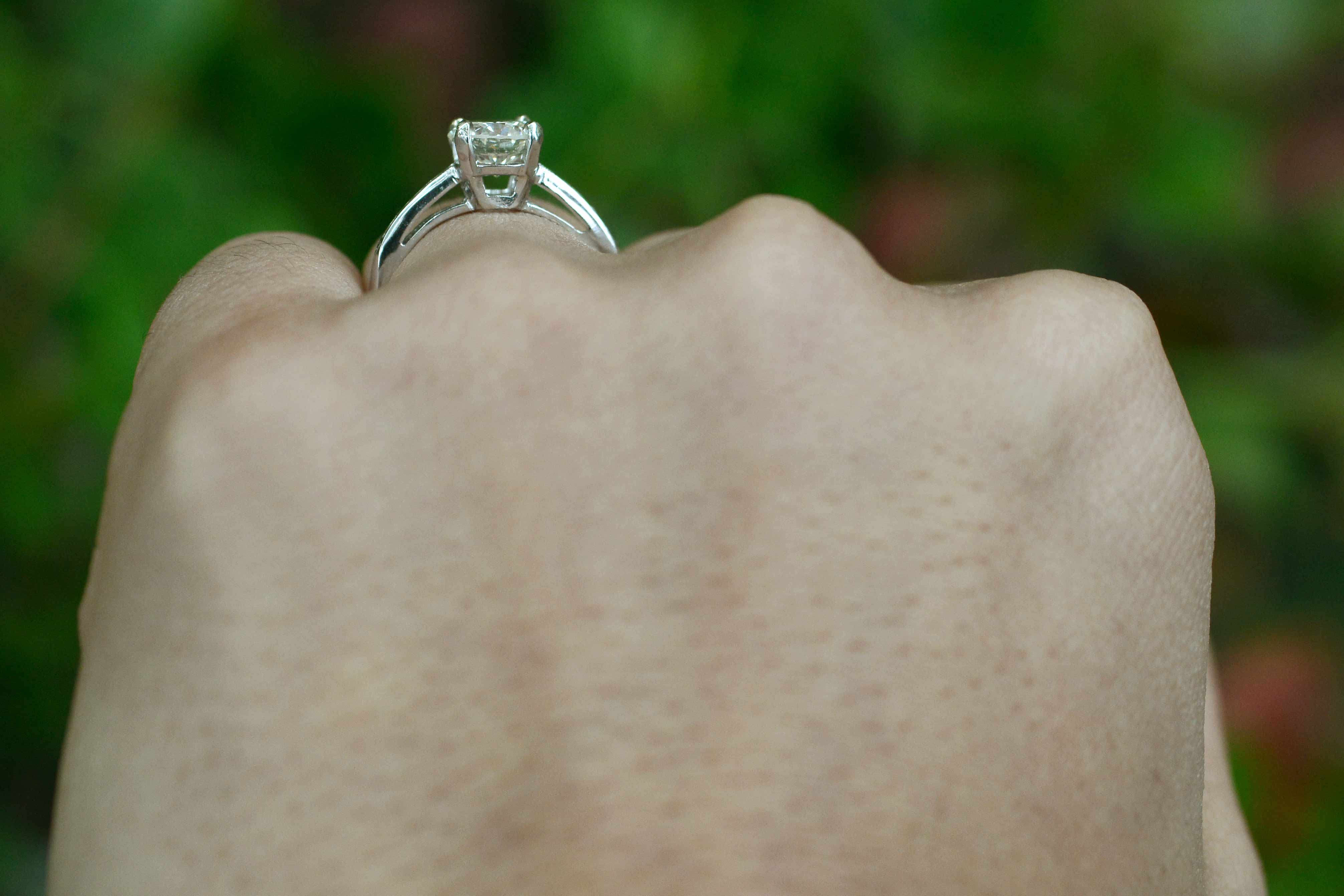 A secure four prong diamond setting solitaire ring.