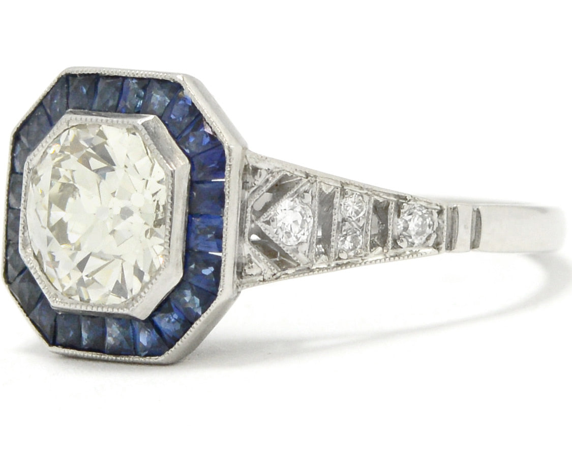 An octagon diamond and blue sapphires target engagement ring.