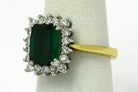 A modern classic three carat cushion green tourmaline ring, set with a halo of diamonds.