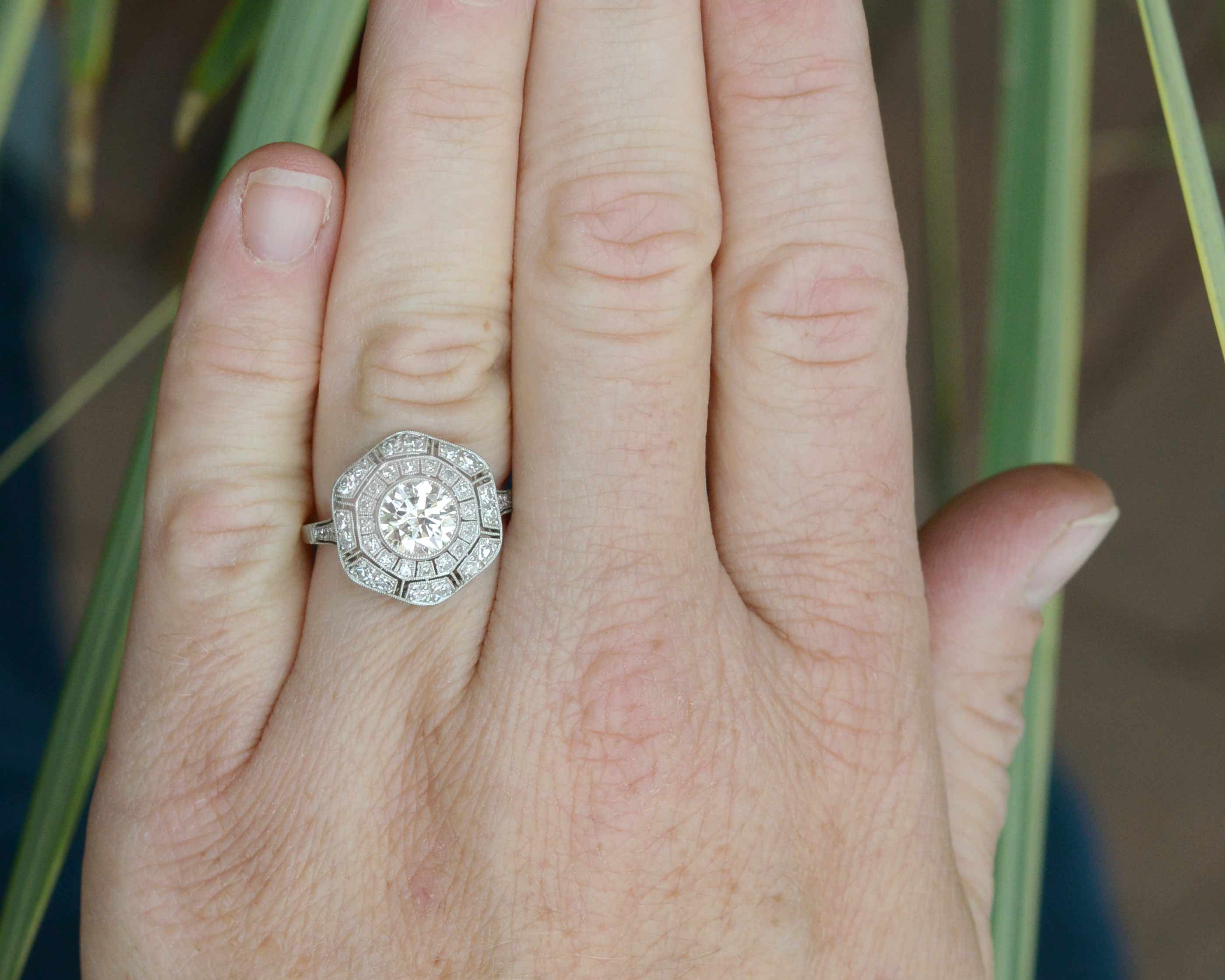 Diamonds platinum flower cluster ring.