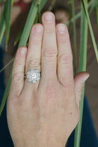 Diamonds platinum flower cluster ring.