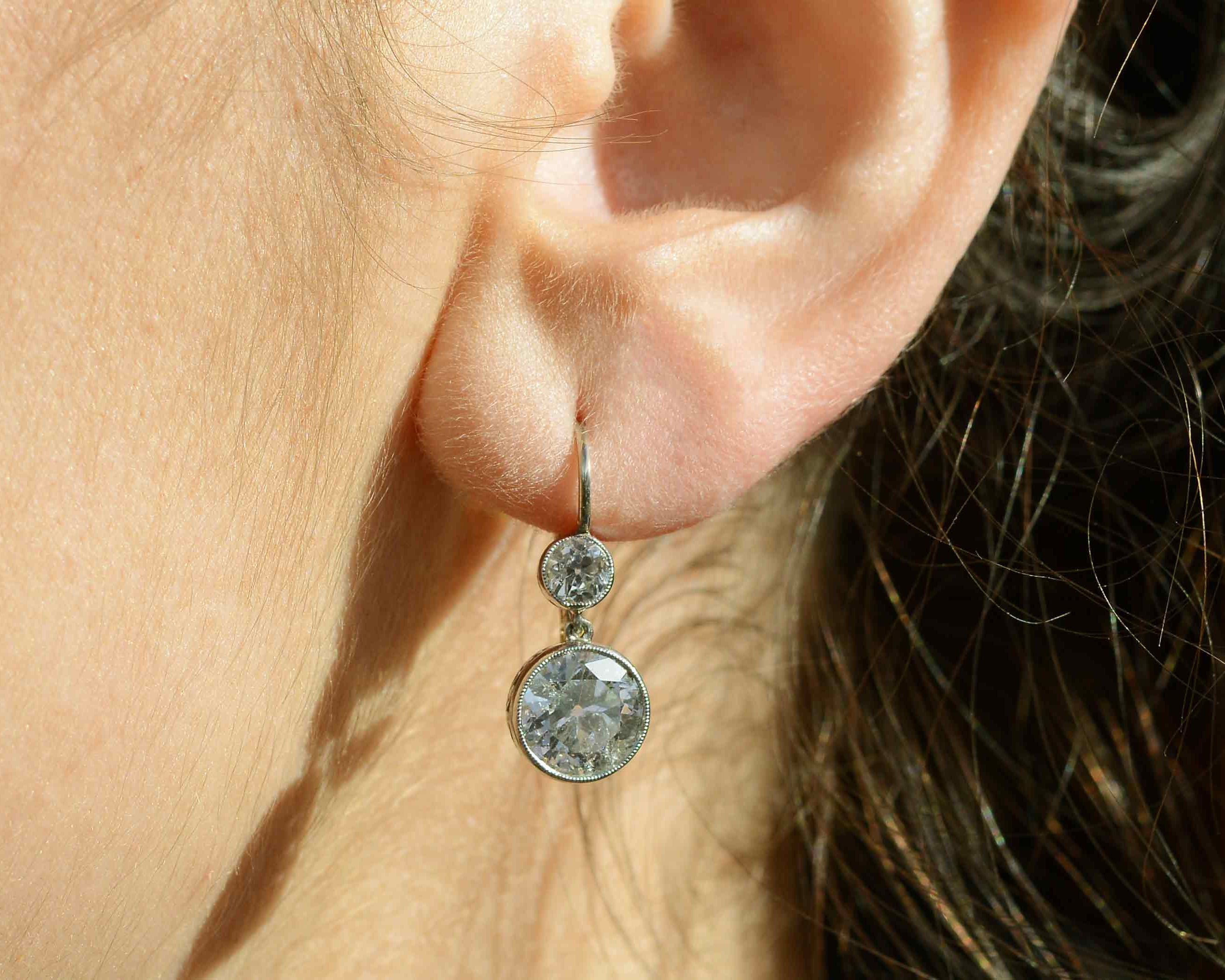 These drop dangle earrings also have old mine cut diamonds, 4 carats total.