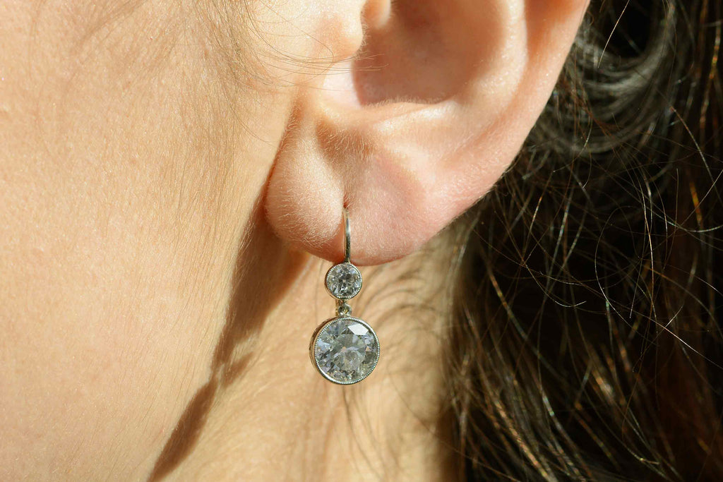 These drop dangle earrings also have old mine cut diamonds, 4 carats total.