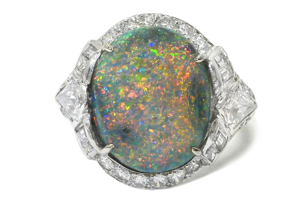 An oval Australian black opal ring, presented in one of our vintage ring boxes.