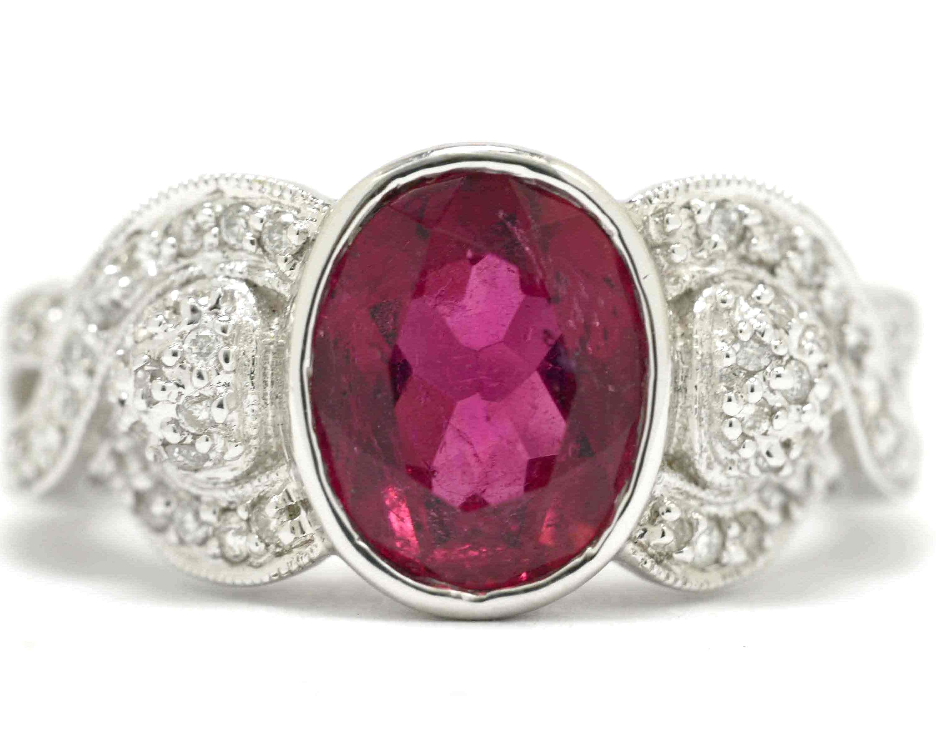 A retro oval pink tourmaline and diamonds engaegment ring.