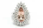A natural, peach-colored morganite gemstone and diamonds statement ring.