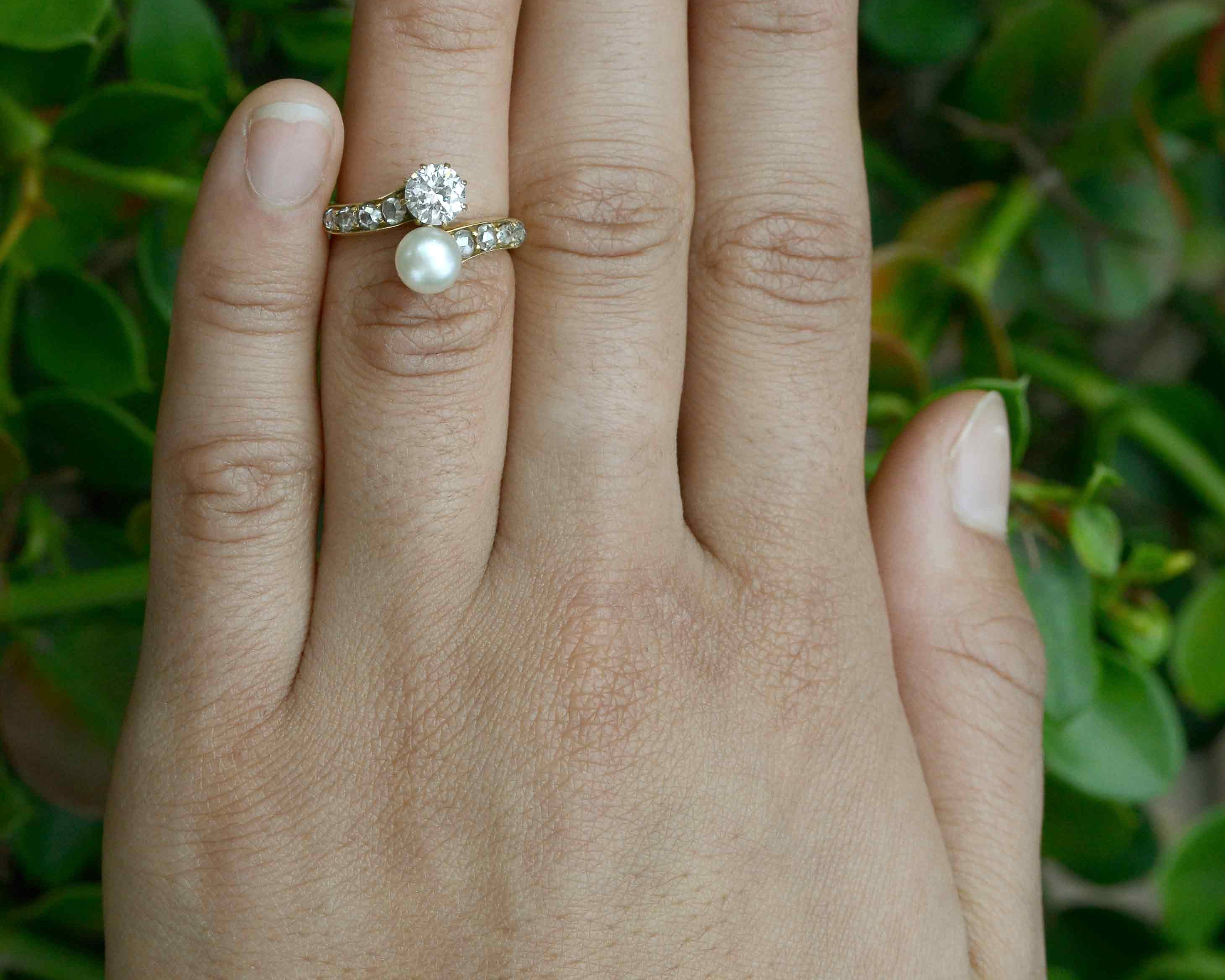 A diamond and pearl toi et moi 2 stone antique wedding ring.