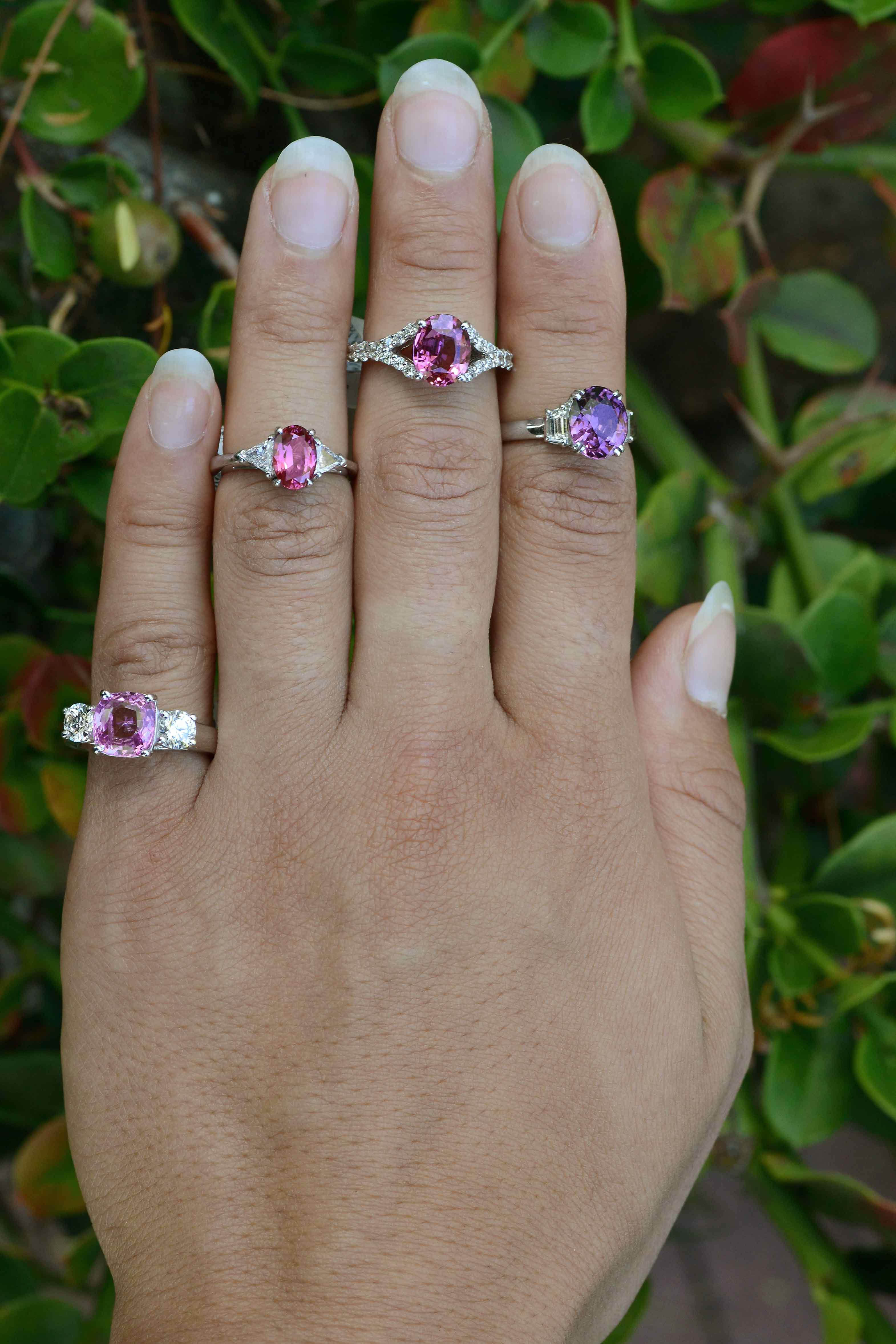 Natural pink and purple sapphire engagement rings with diamonds available.