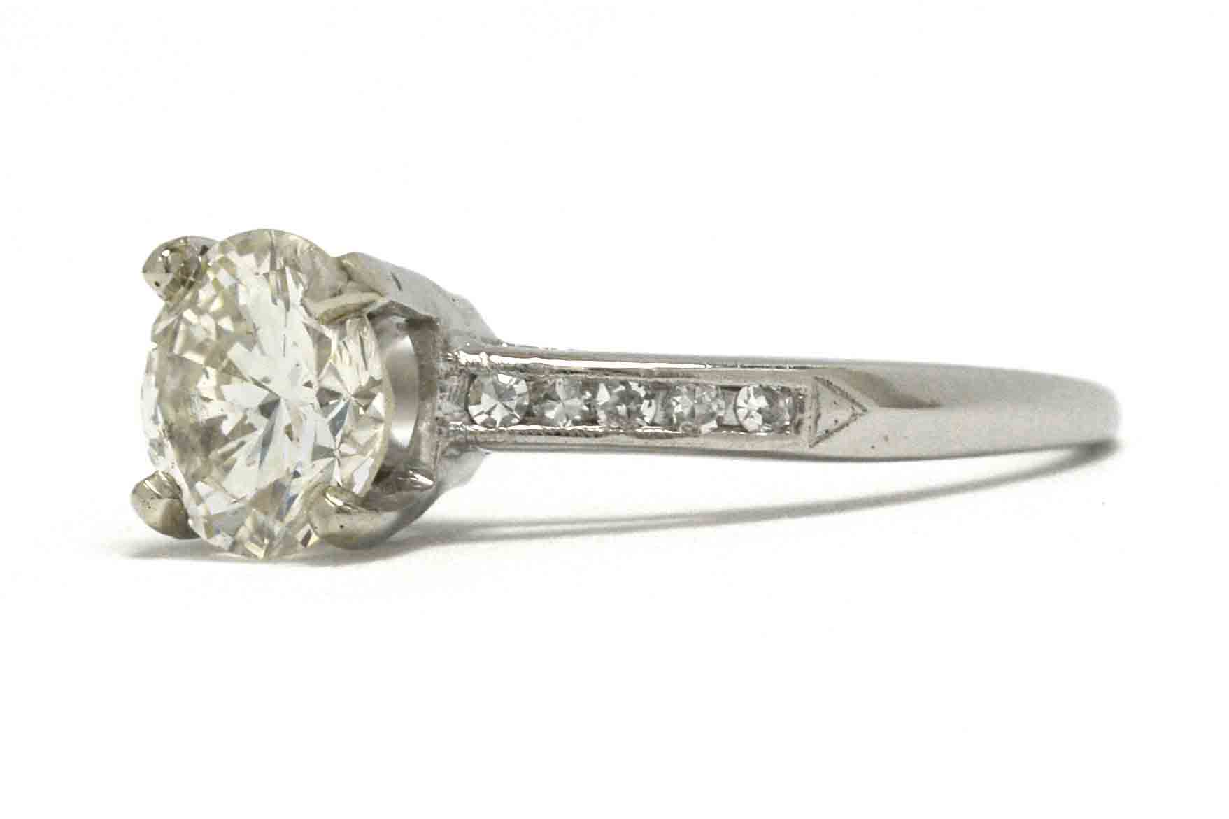 A size 6 1/2 platinum diamond solitaire wedding ring.