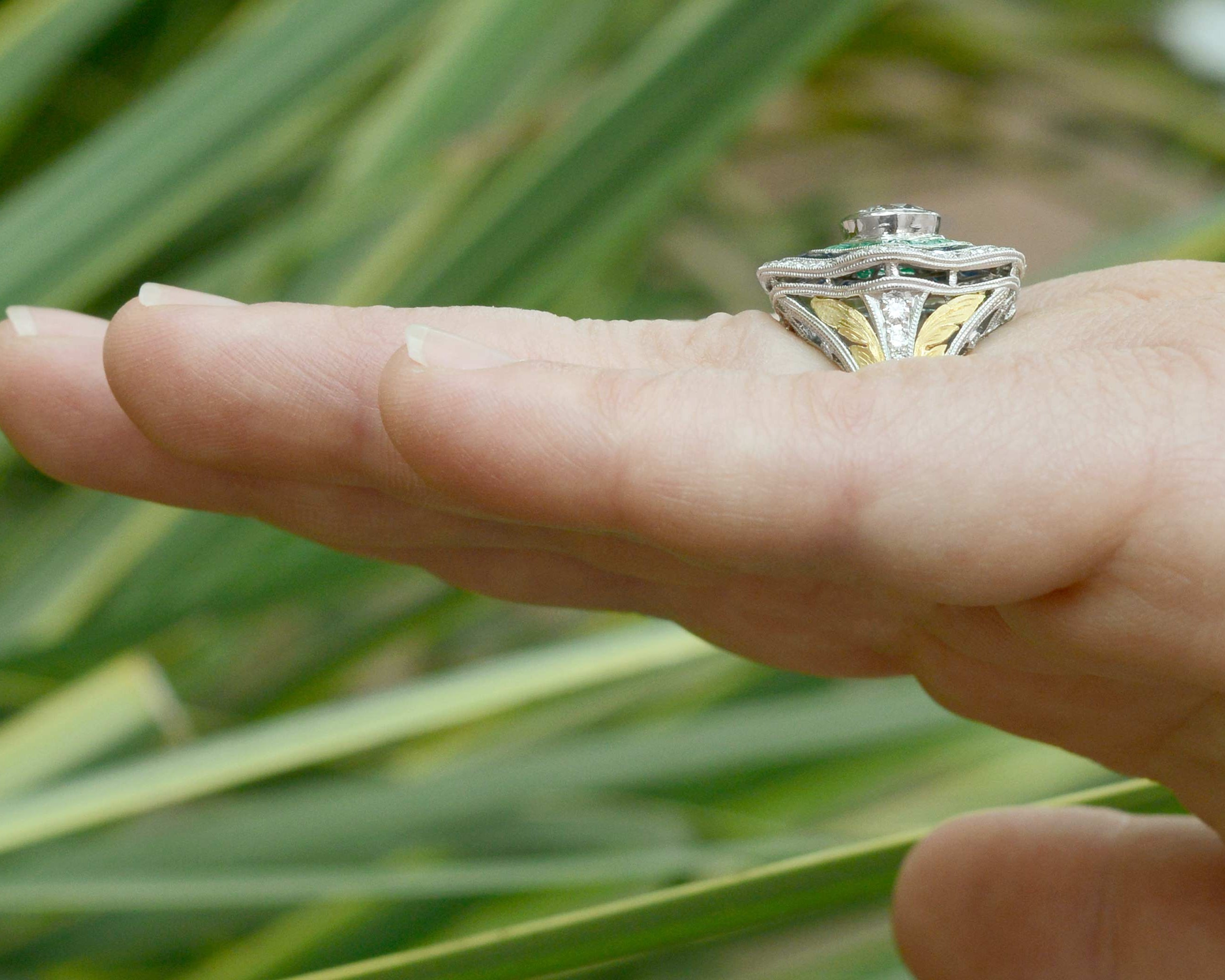 Gold leafs accent the filigree diamond Art Deco statement ring.