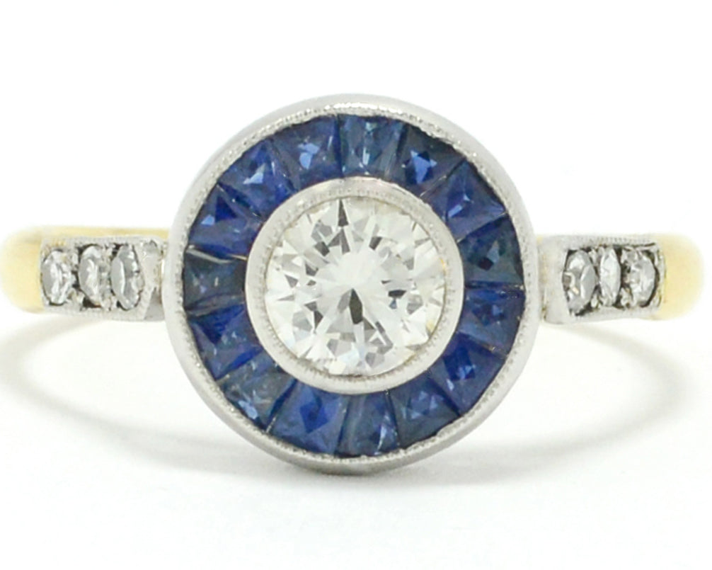 This blue sapphire target ring has a yellow gold band.