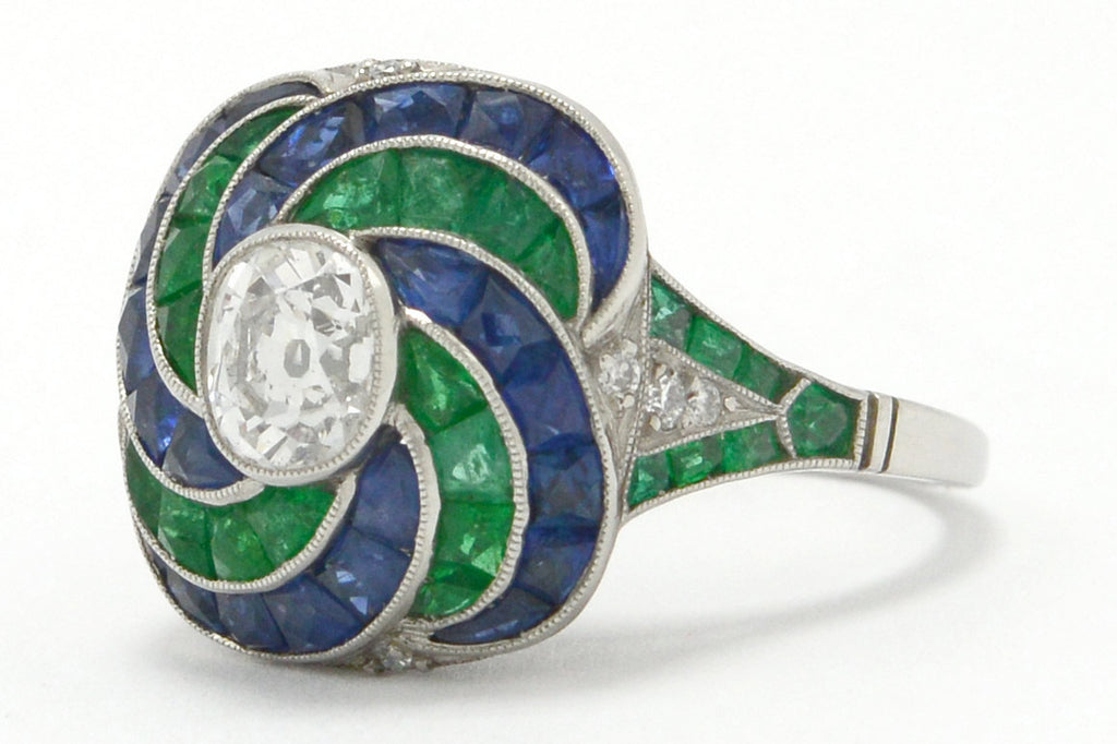 There is 4 carats of emeralds, sapphires and diamonds in this Art Deco revival wedding ring.