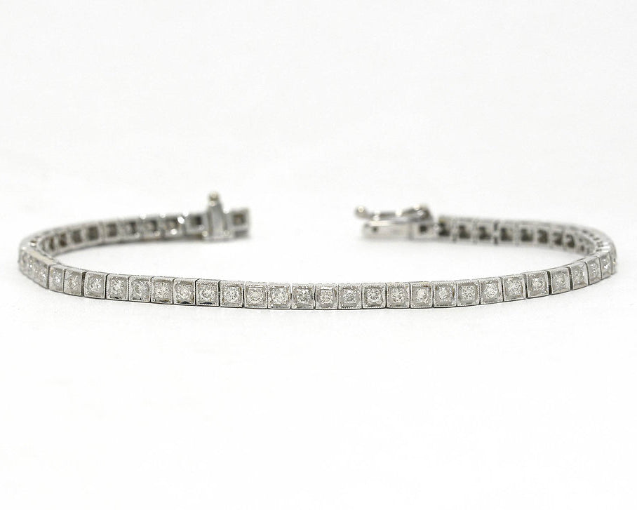 Two carats of straight line set diamonds in a 1940s white gold tennis bracelet.
