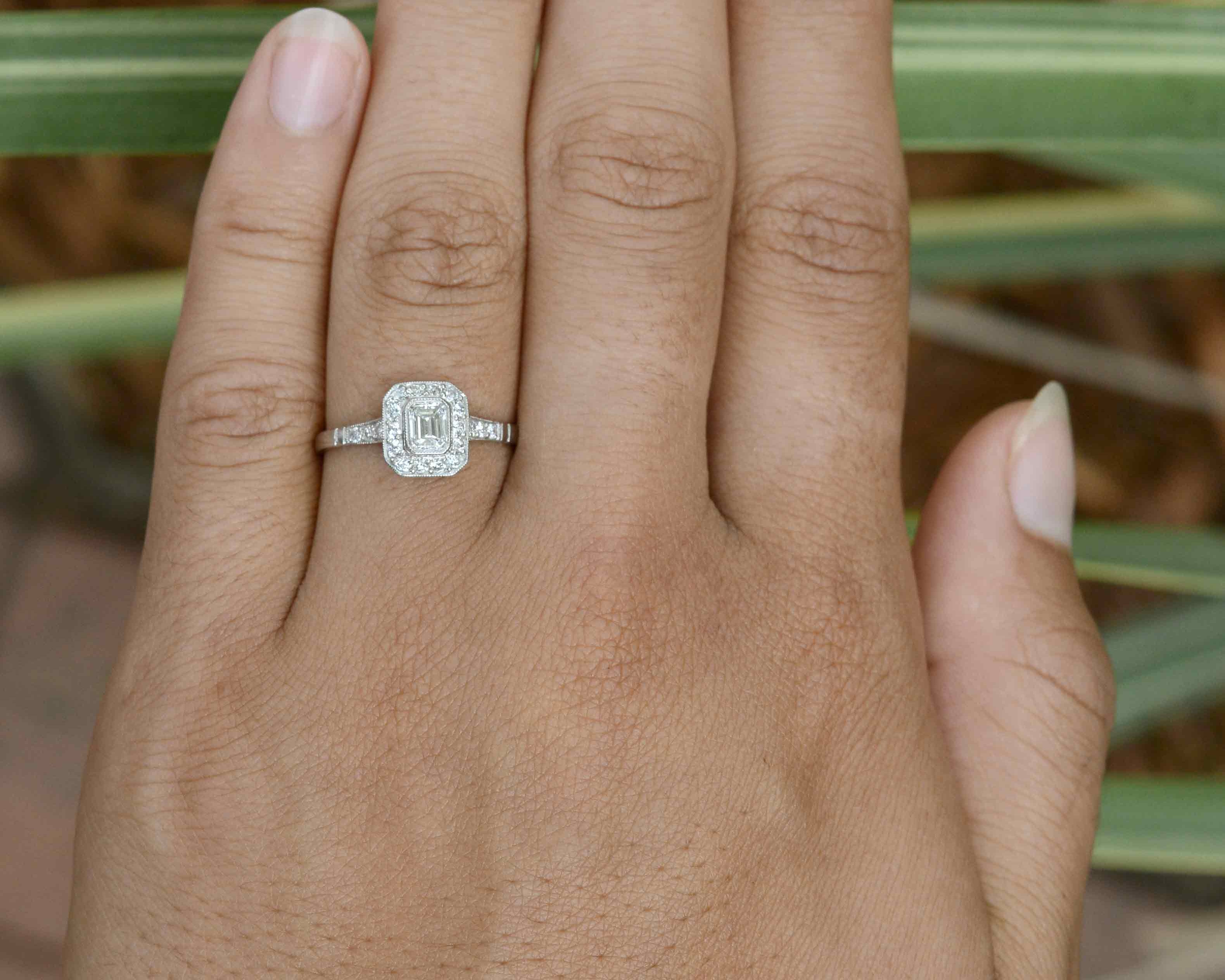 A rounded square platinum Art Deco engagement ring design.