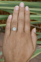 A rounded square platinum Art Deco engagement ring design.