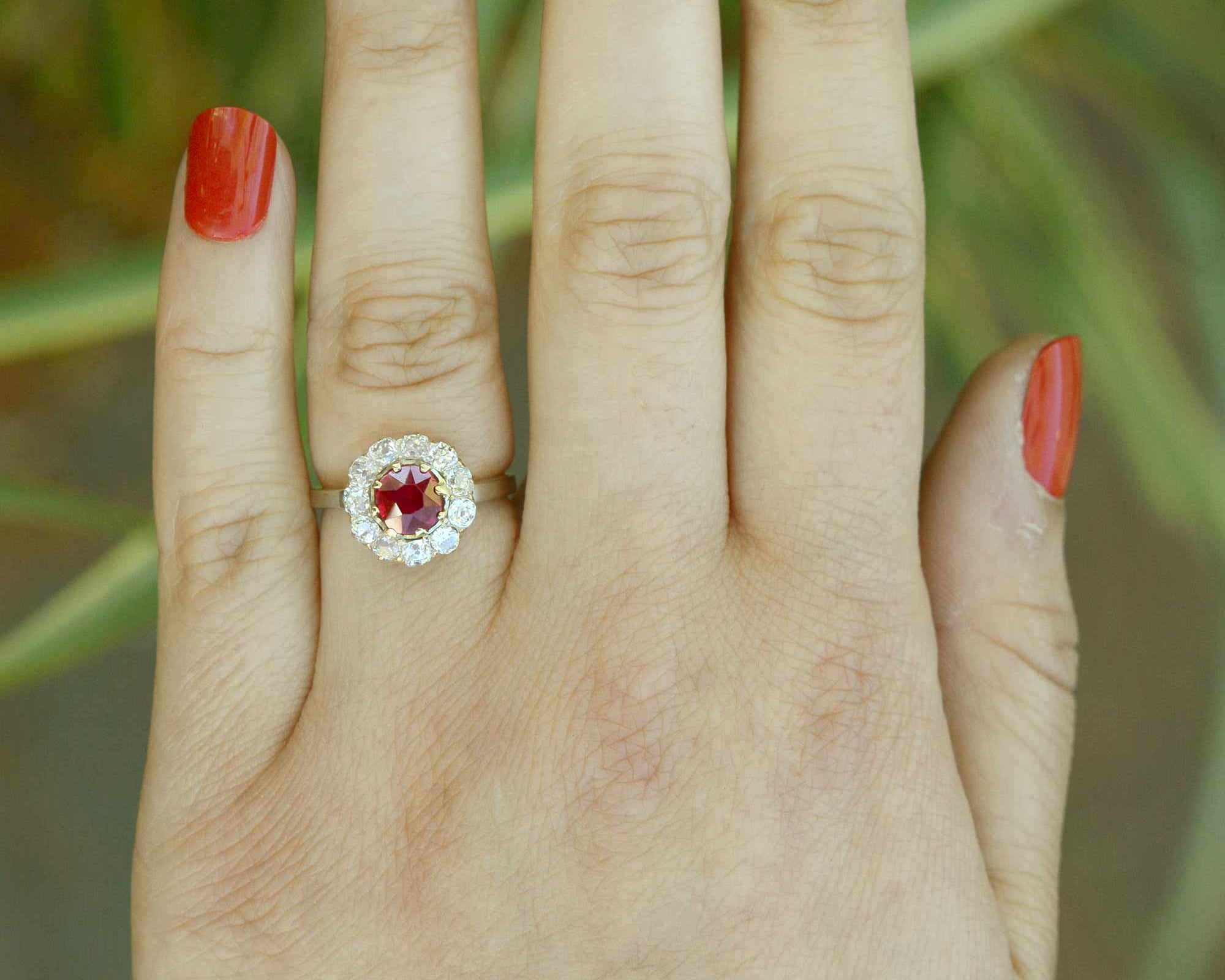A unique size 5 platinum ruby engagement ring with an 18k gold center setting.