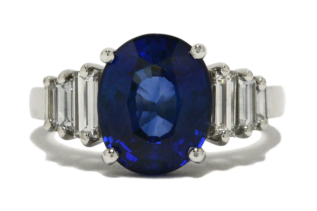 An Art Deco revival engagement ring featuring a large, 4 carat oval blue sapphire.