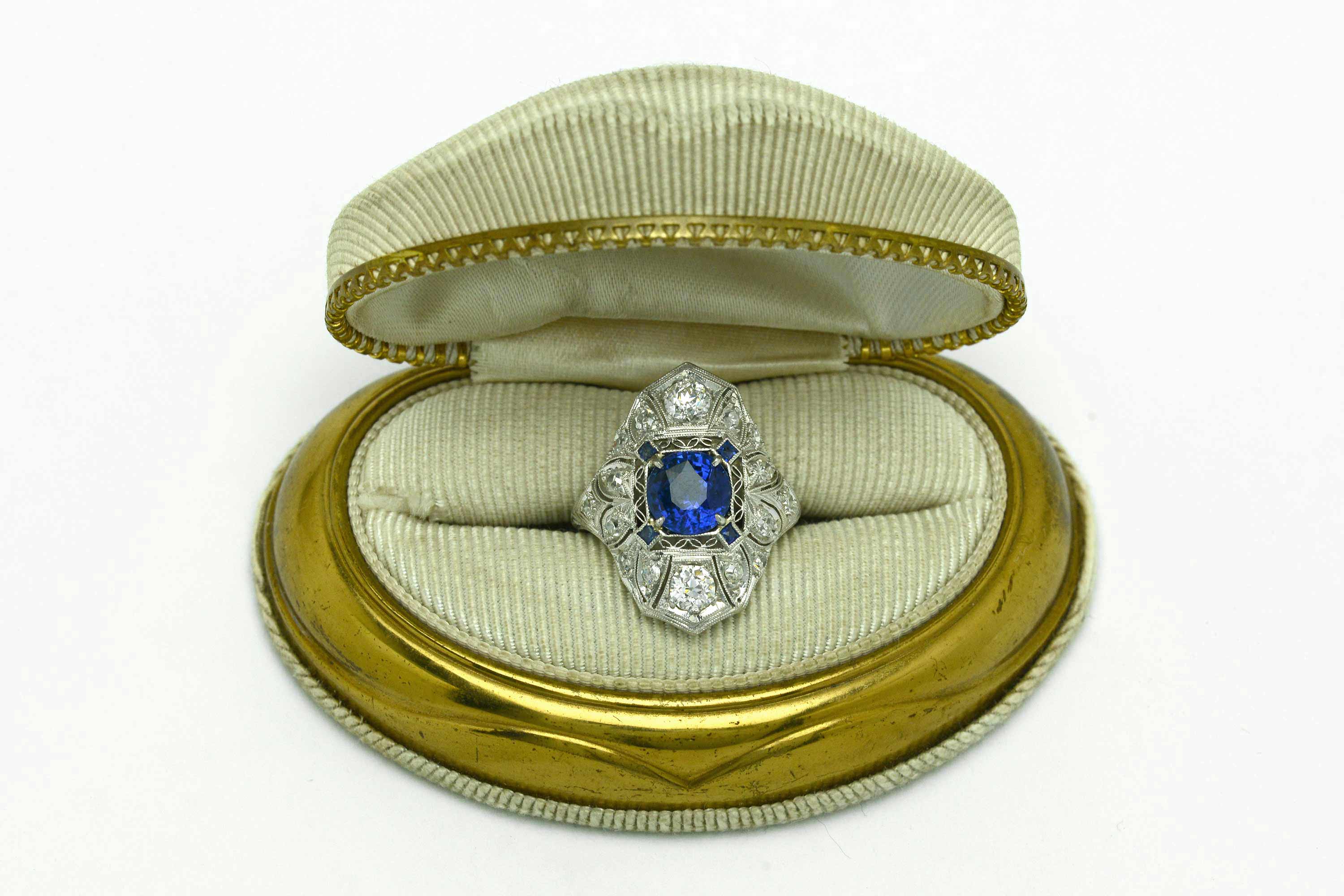 An Edwardian sapphire engagement ring from the early 1900s in a presentation box.