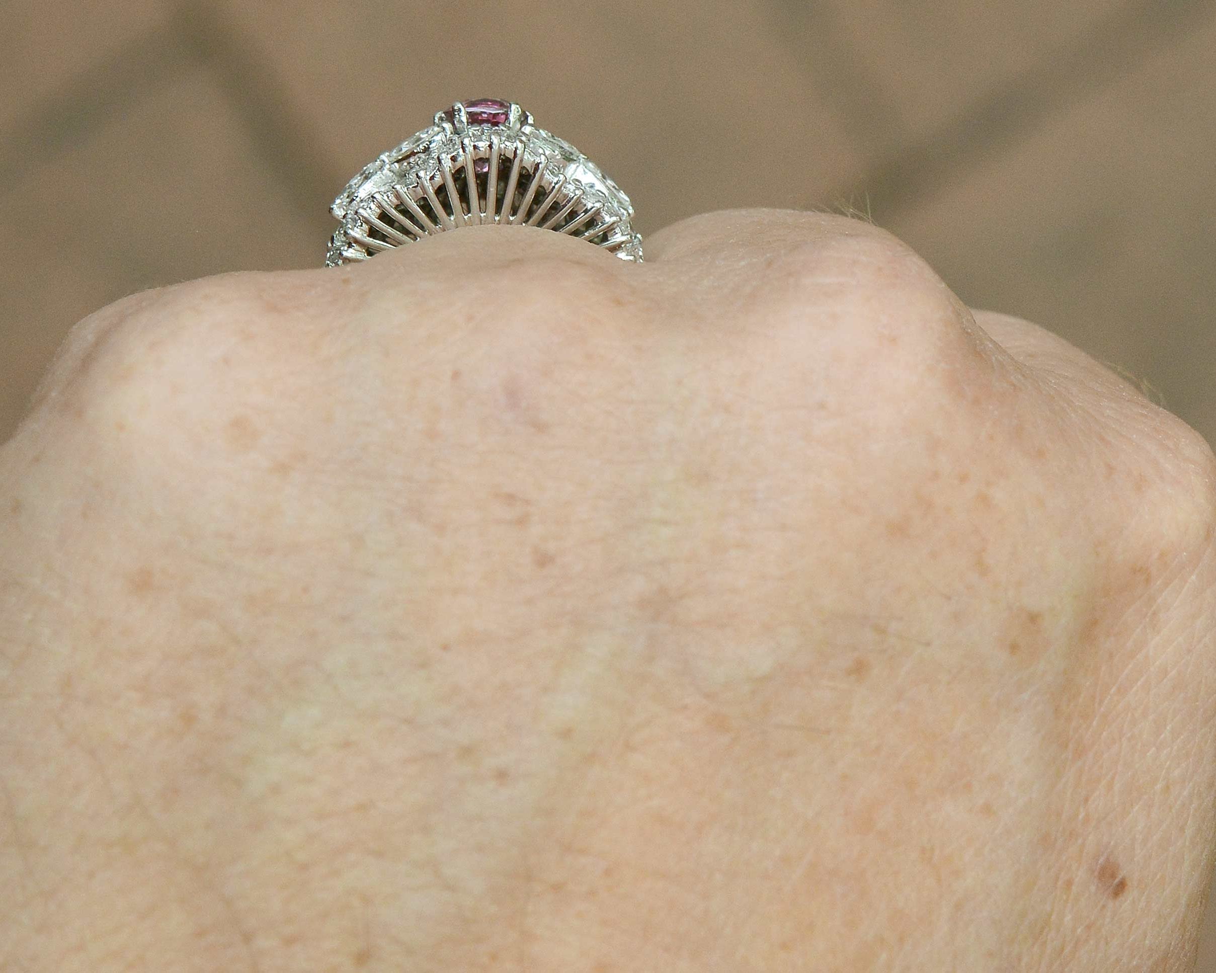 Baguette and marquise cut diamonds accent this mid century pink sapphire platinum ring.