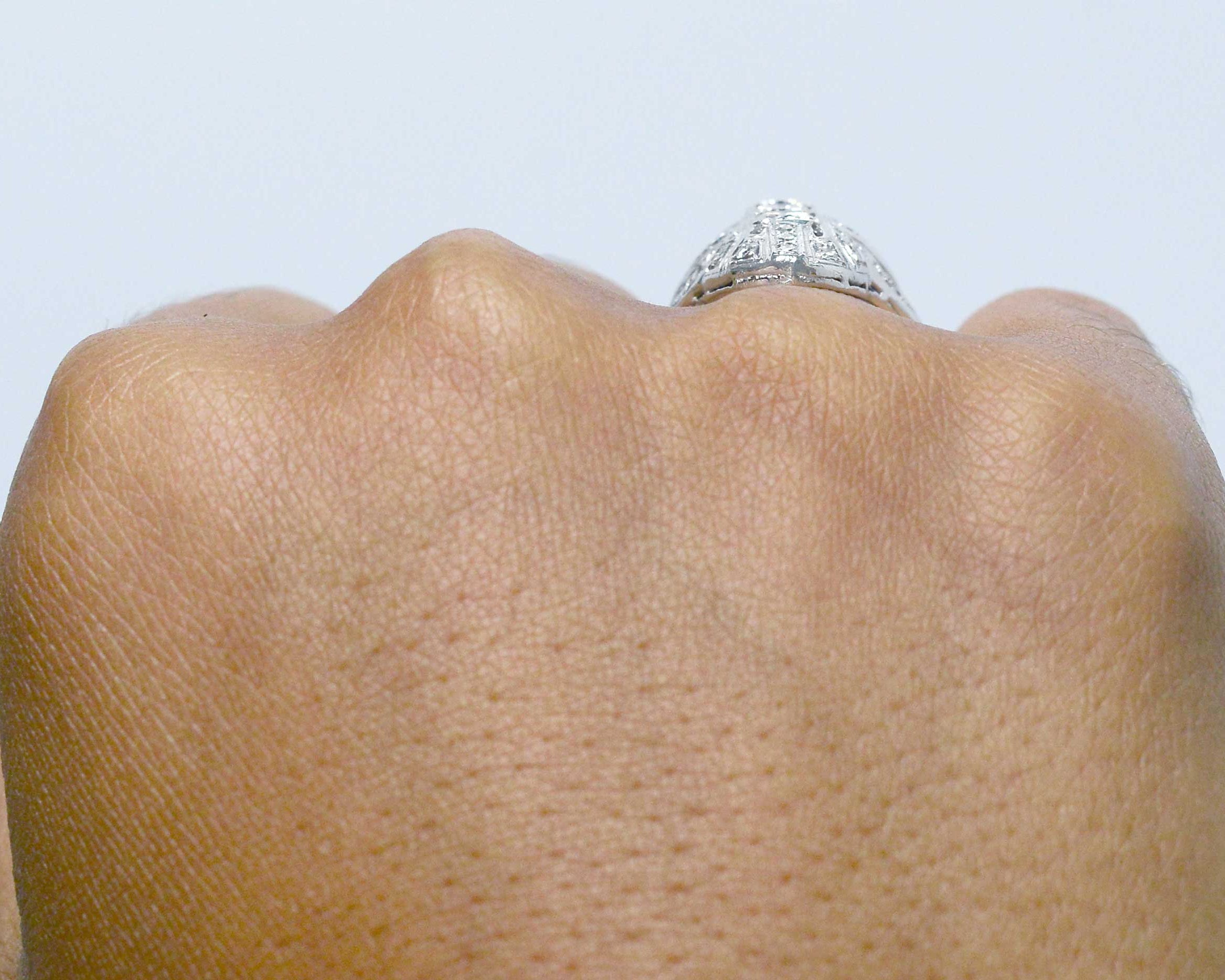 Filigree diamonds shield ring.