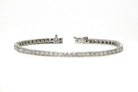 A slide lock and safety clasp keeps this white gold tennis bracelet secure.