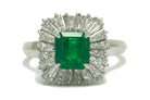 A mid-century 1960s emerald target ring, surrounded by diamonds.
