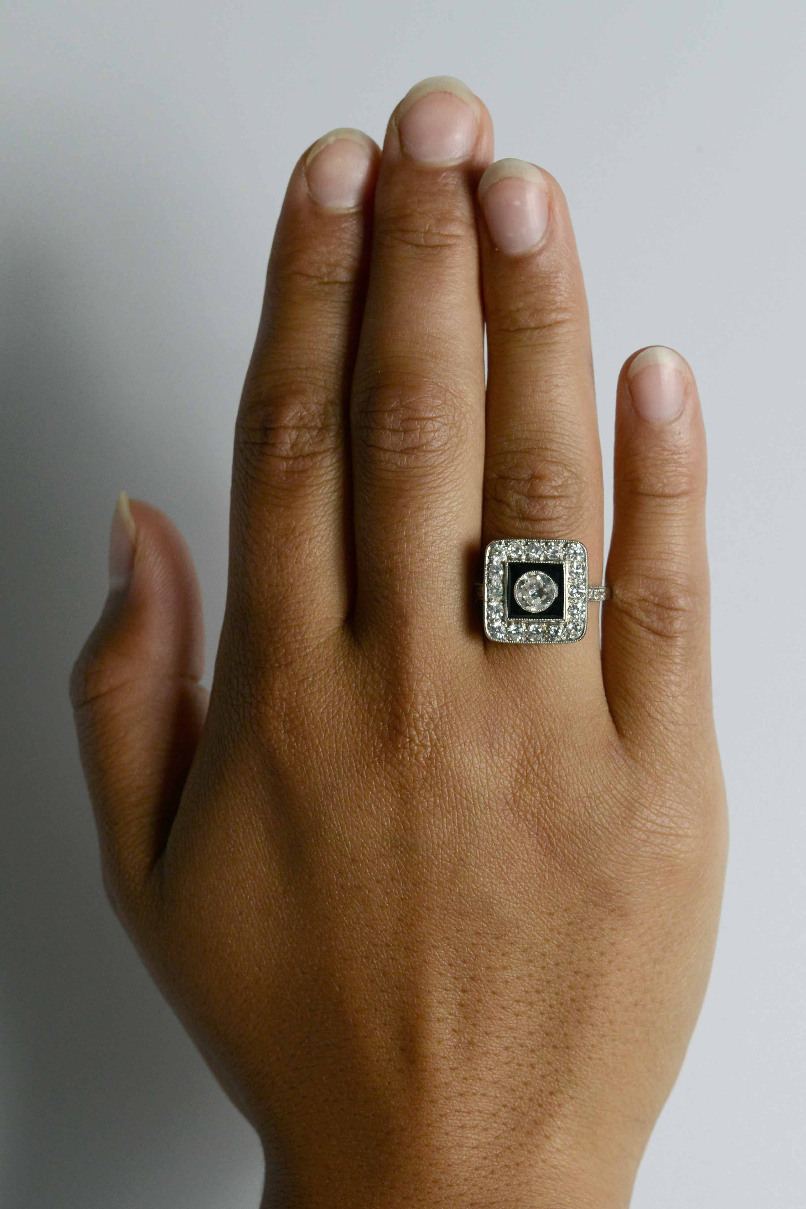 A square Art Deco wedding ring with diamonds and black onyx.