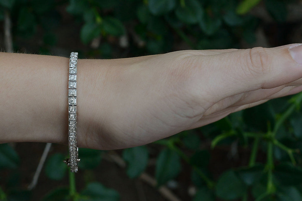 Two carats of diamonds are set in a straight line in this white gold tennis bracelet.