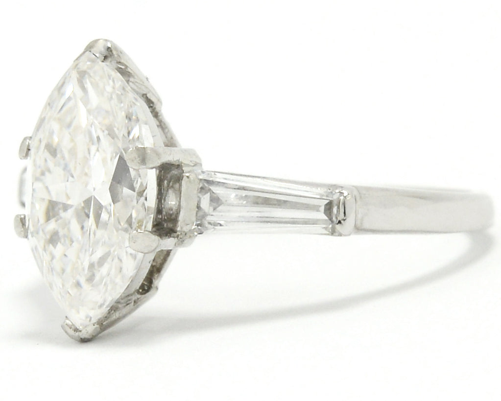 A platinum, antique Art Deco engagement ring with a two carat marquise diamond.