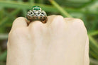 A tall, 3 carat oval cabochon emerald set in a Victorian statement ring.