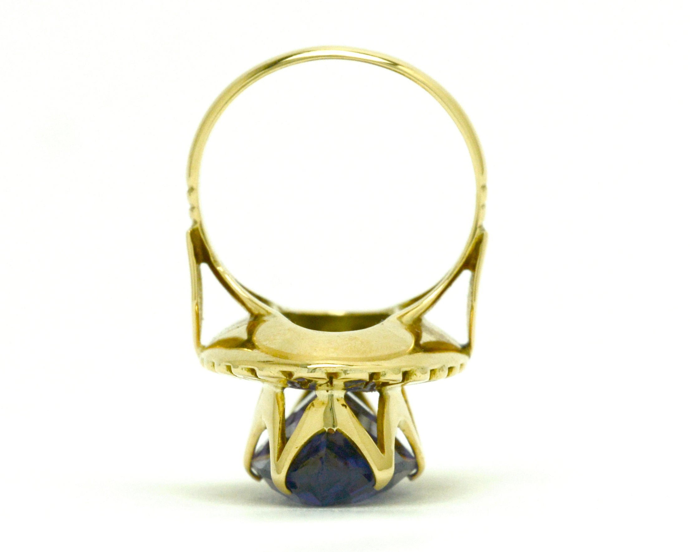 A tall gold retro cocktail ring with a marquise cut amethyst.