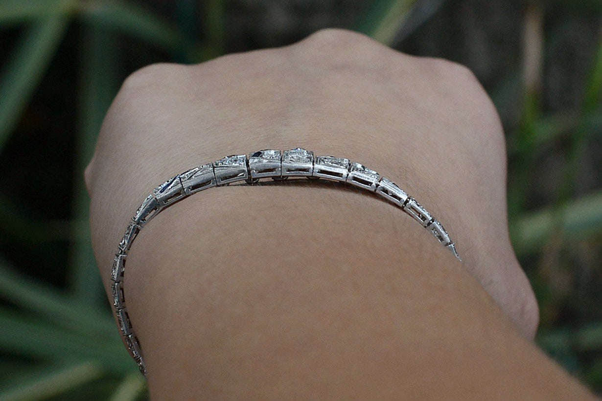 A tapered platinum diamonds bracelet.