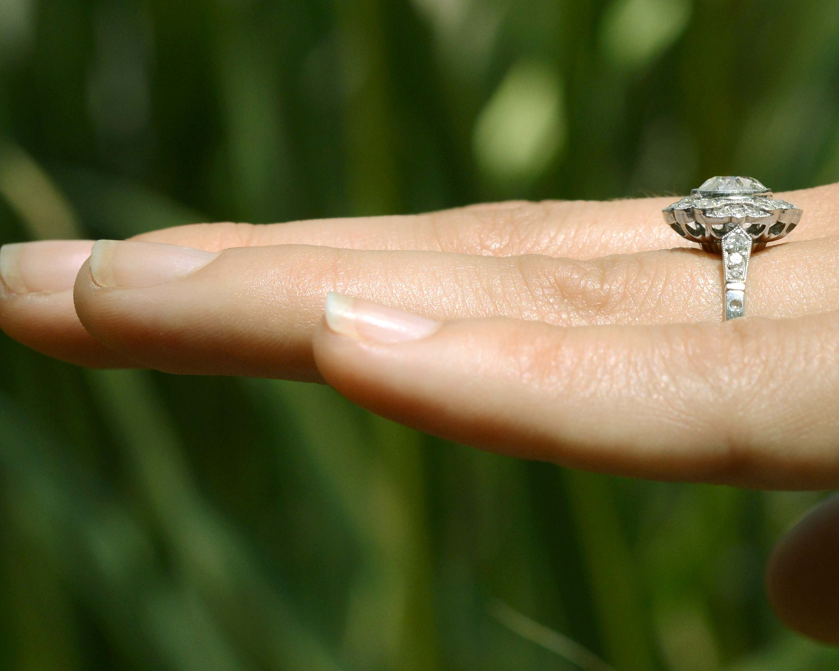 This engagement ring has diamonds on the band.