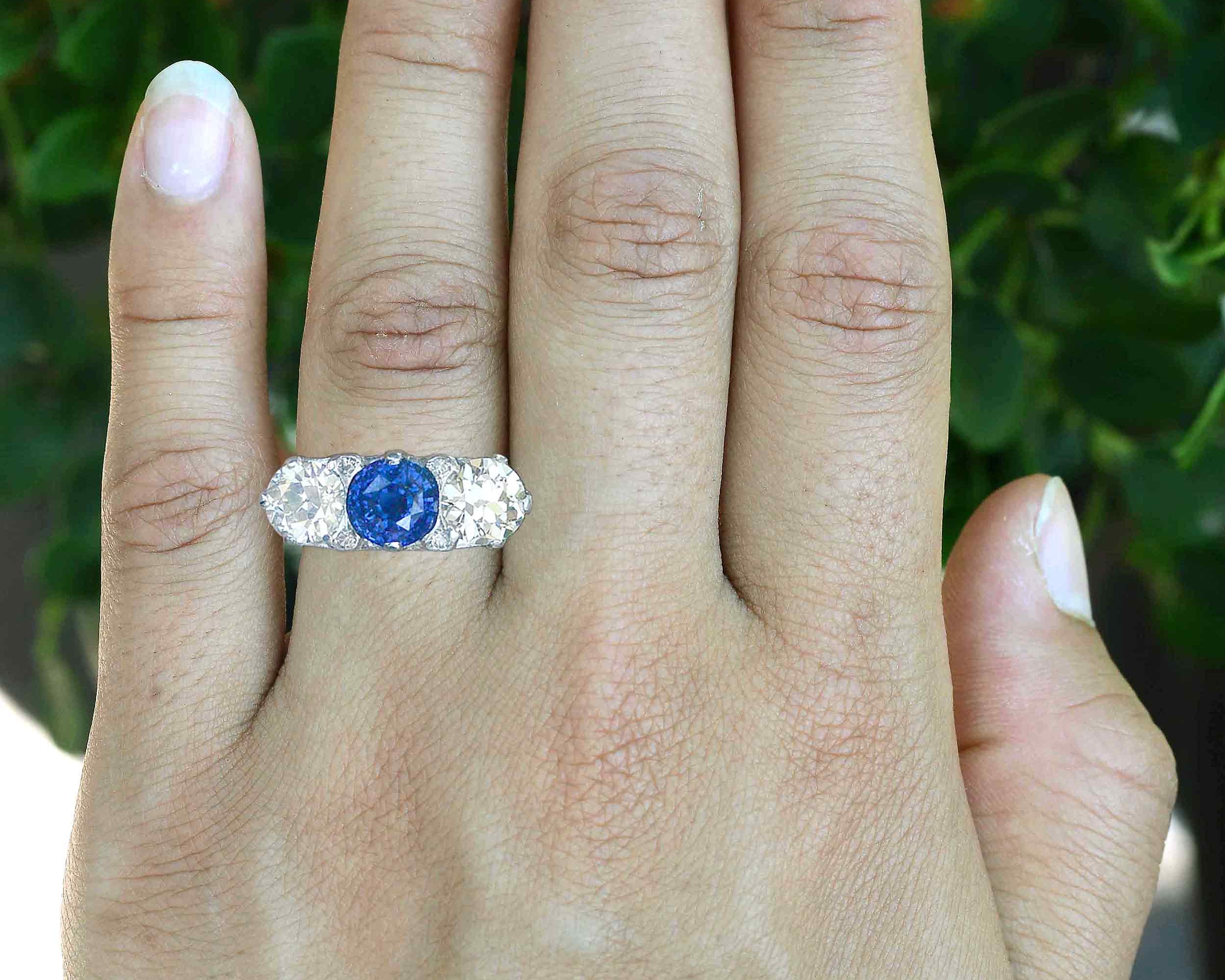 3 carat blue sapphire three stone engagement ring.