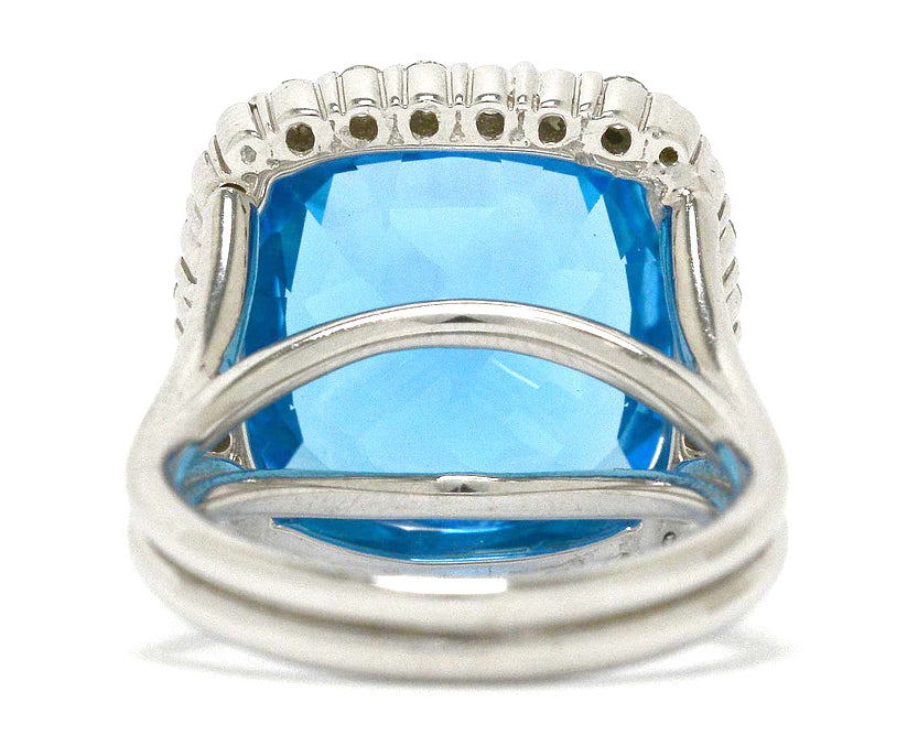 A vivid, swiss blue topaz in a 14k white gold ring setting.