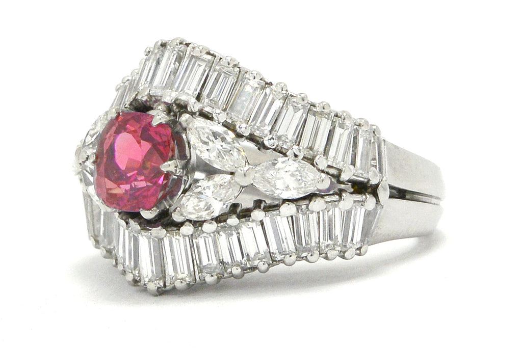 A floral pink sapphire vintage engagement ring by the designer Yanes.
