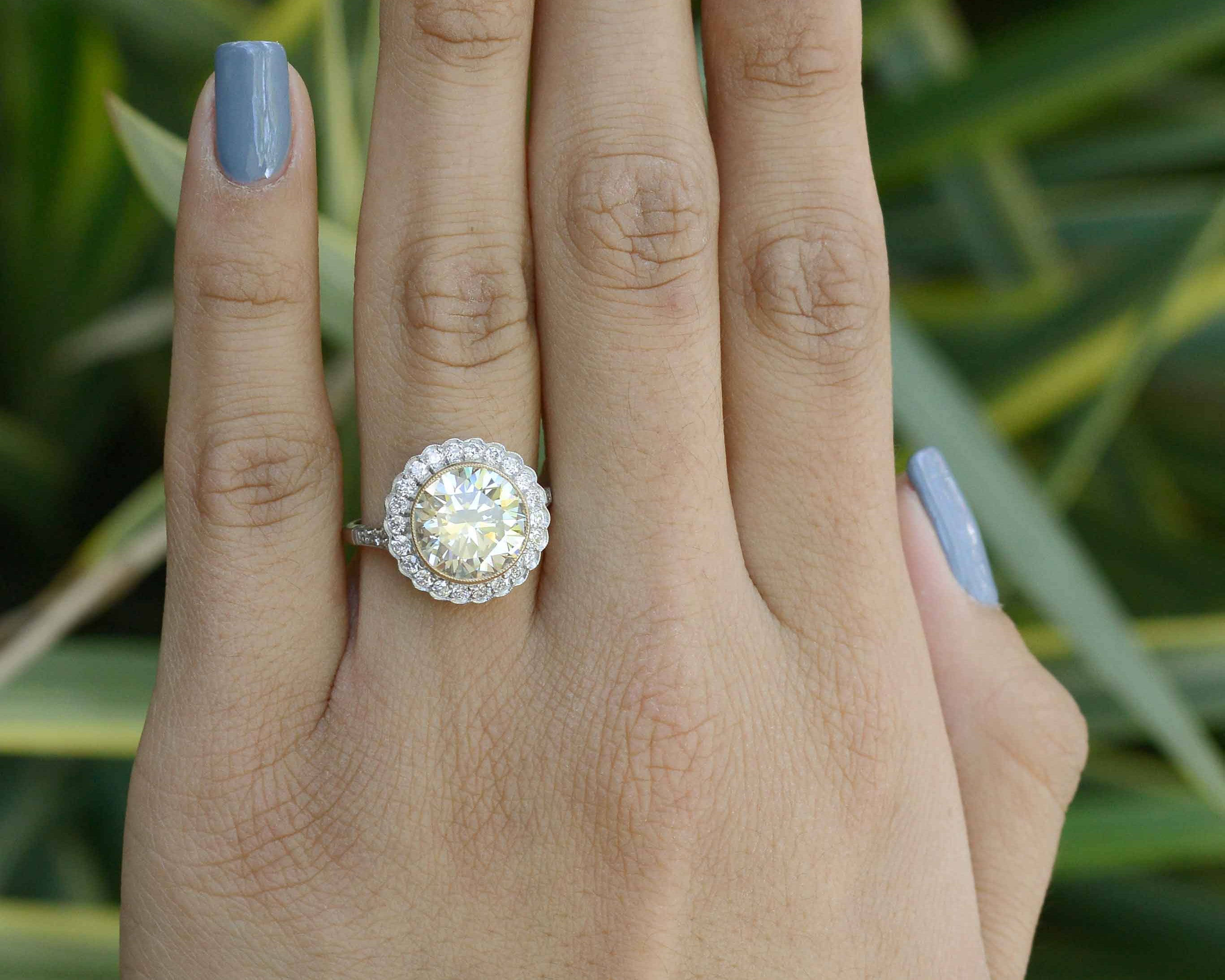 A huge diamond solitaire surrounded by a scalloped halo.