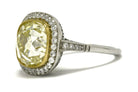 Light yellow 5 carat cushion diamond platinum engagement ring.