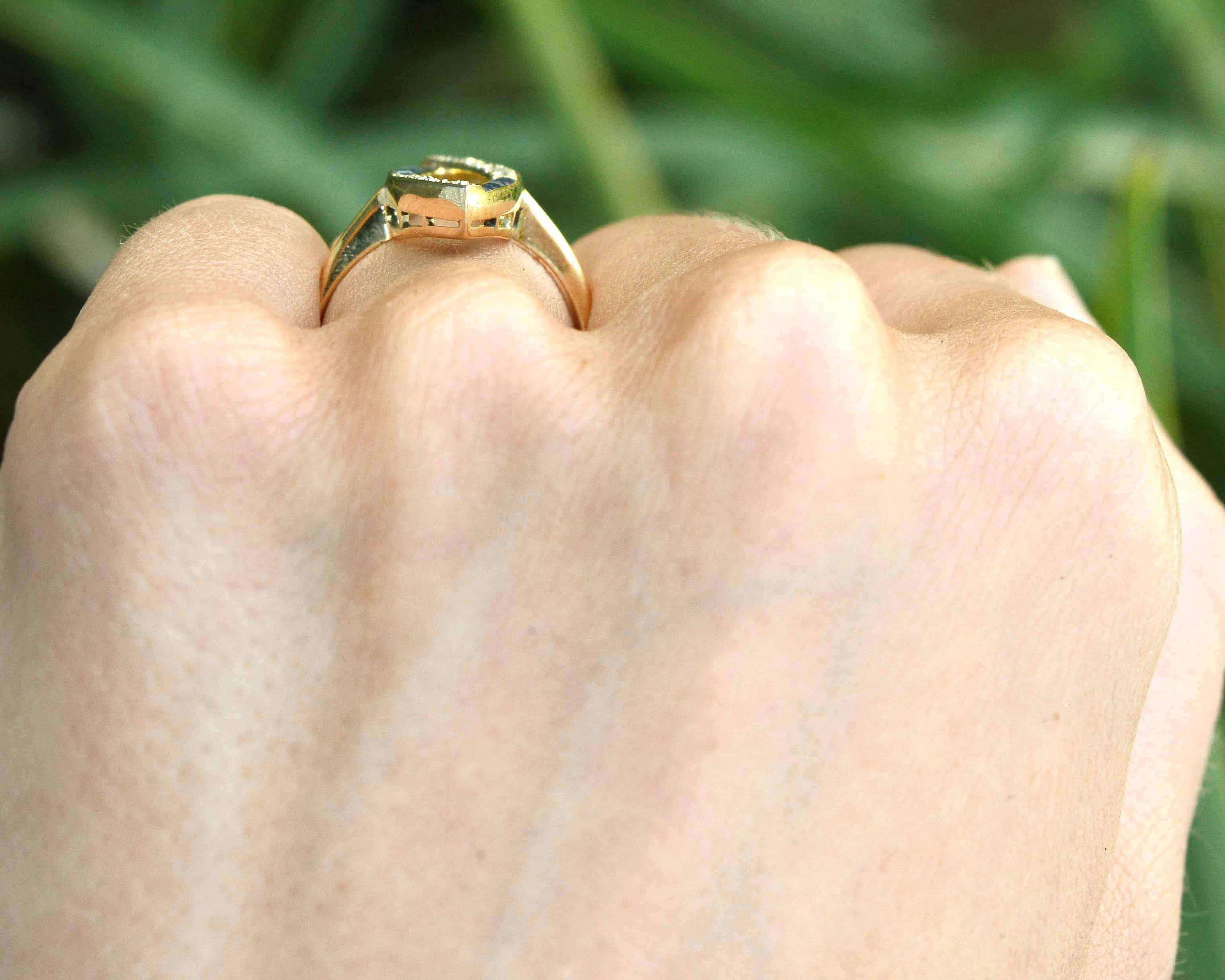 A long, 18k yellow gold navette shaped statement ring.